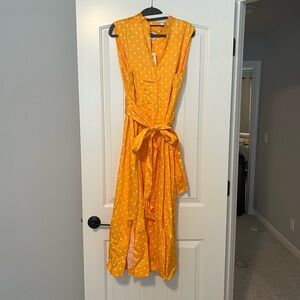 Never worn, yellow sleeveless polkadot dress